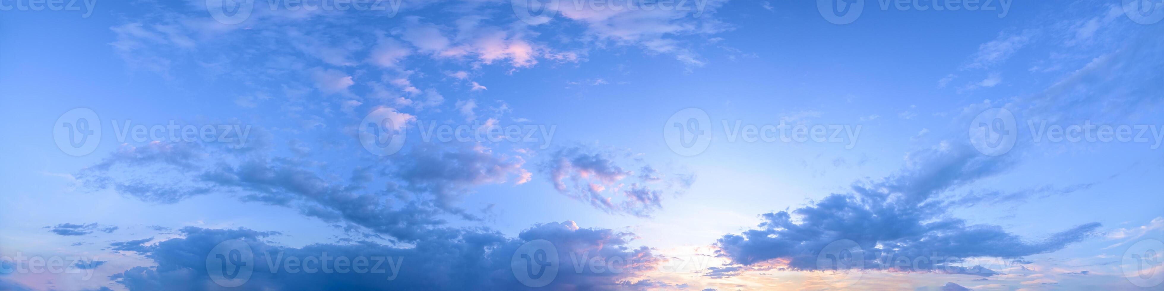A beautiful sunset over the ocean with clouds photo