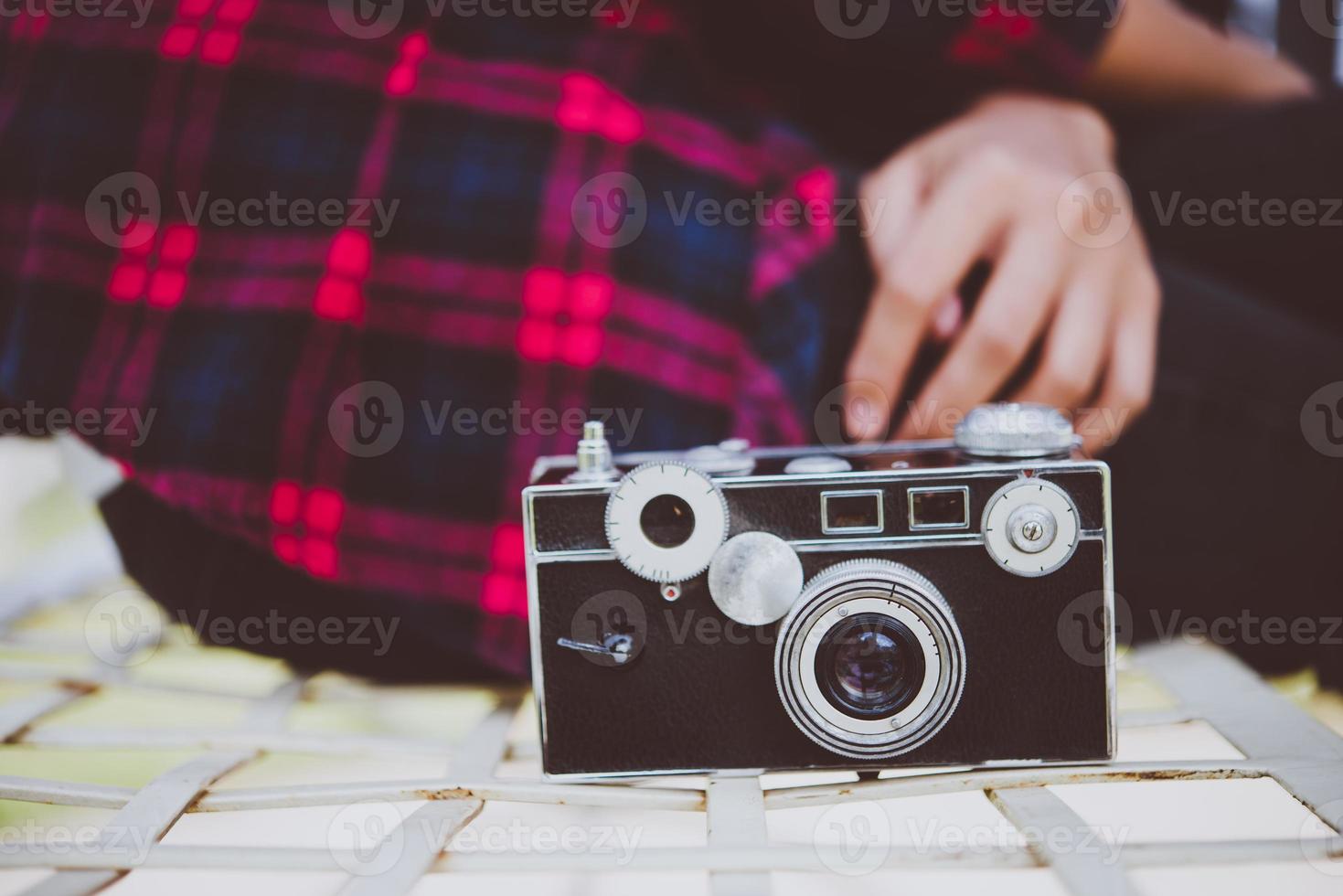 Close-up of hipster woman with vintage camera photo