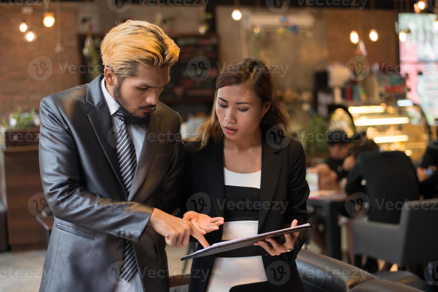 Business team working at coffee shop photo