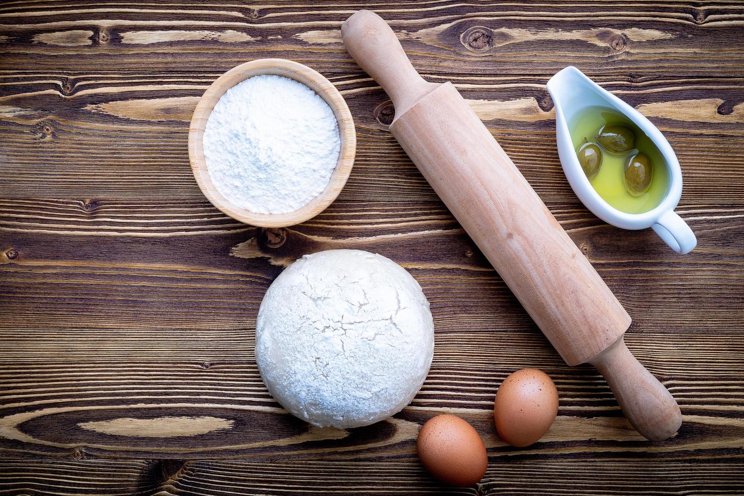 Pizza dough and rolling pin photo