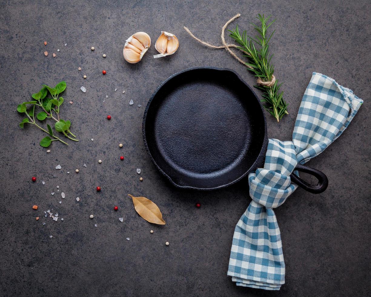 Cast iron skillet on a dark stone background photo