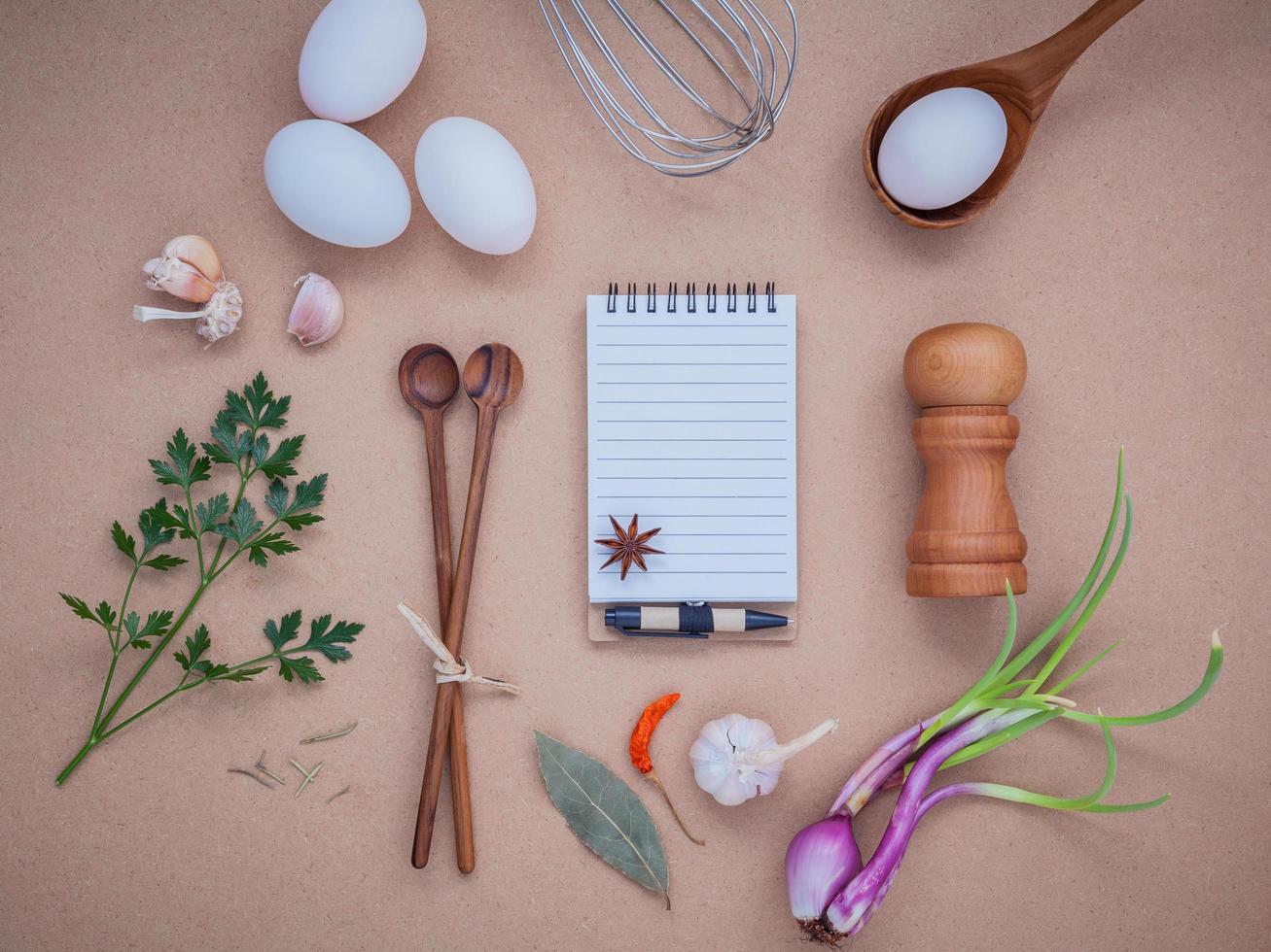 Notebook with cooking ingredients photo