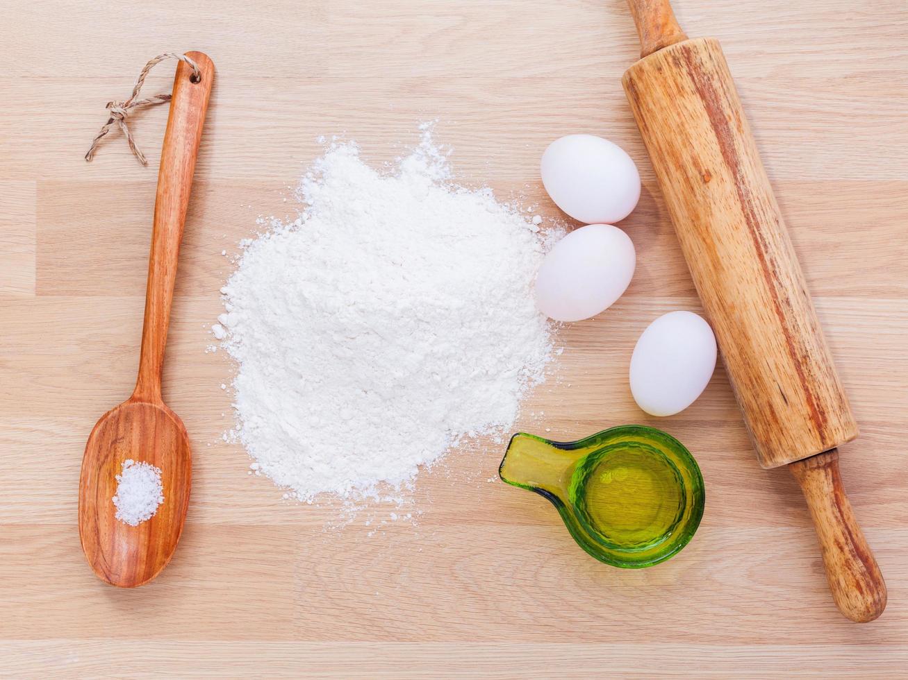 Pasta ingredients on wood photo