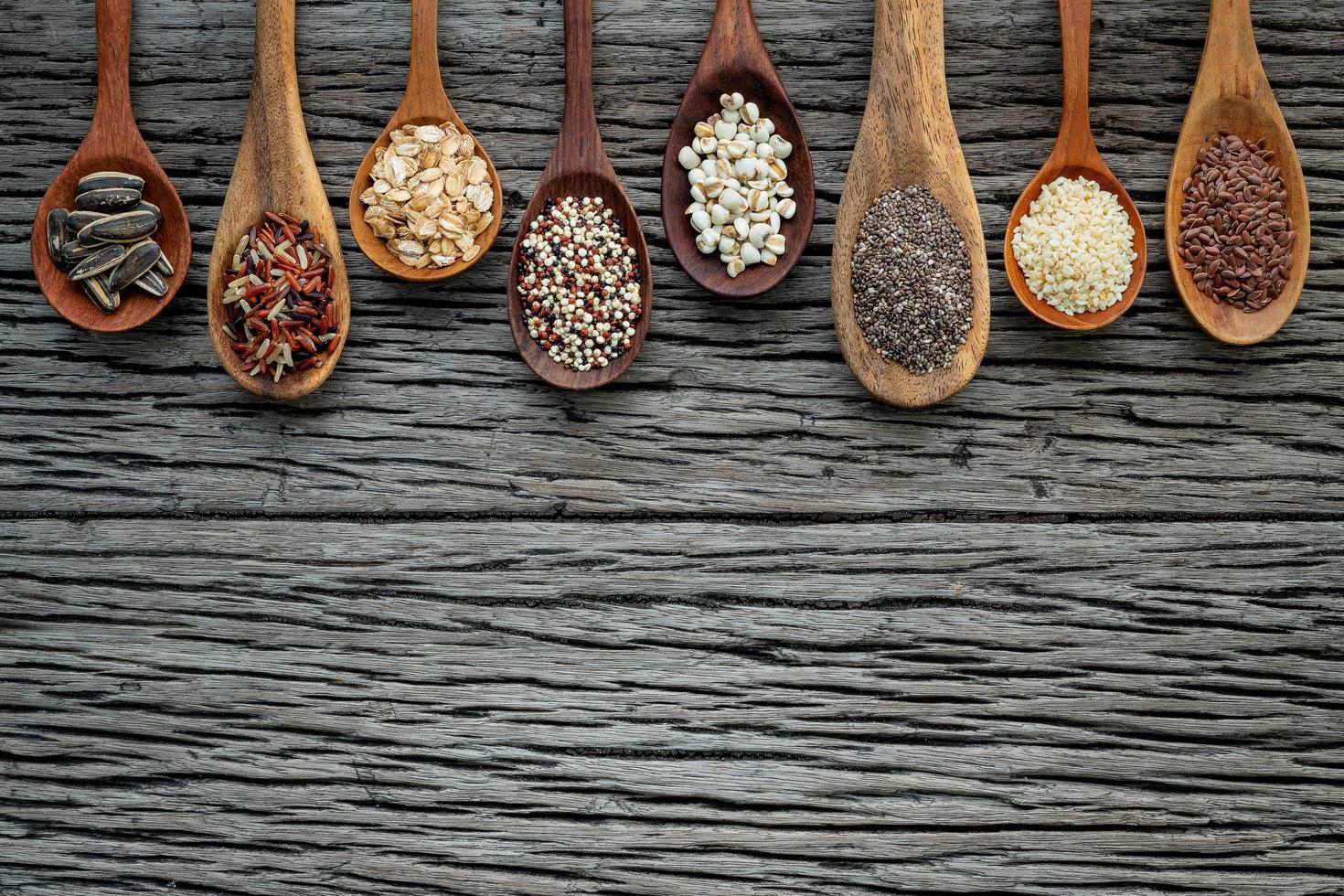 Border of grains in wooden spoons photo