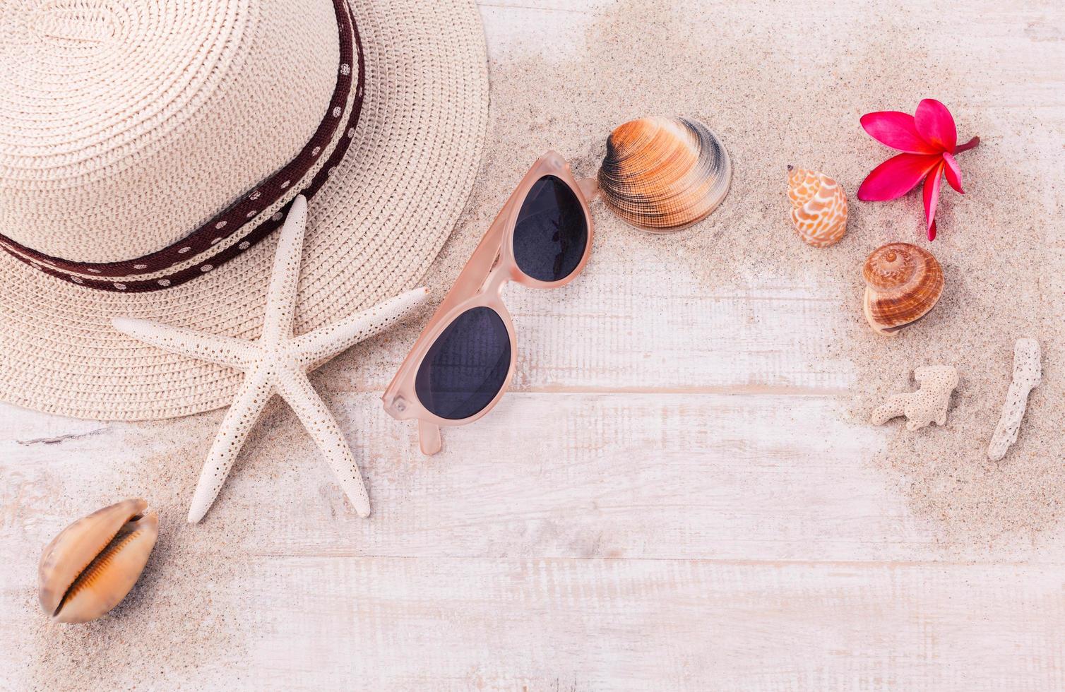 Summer accessories on wooden background photo