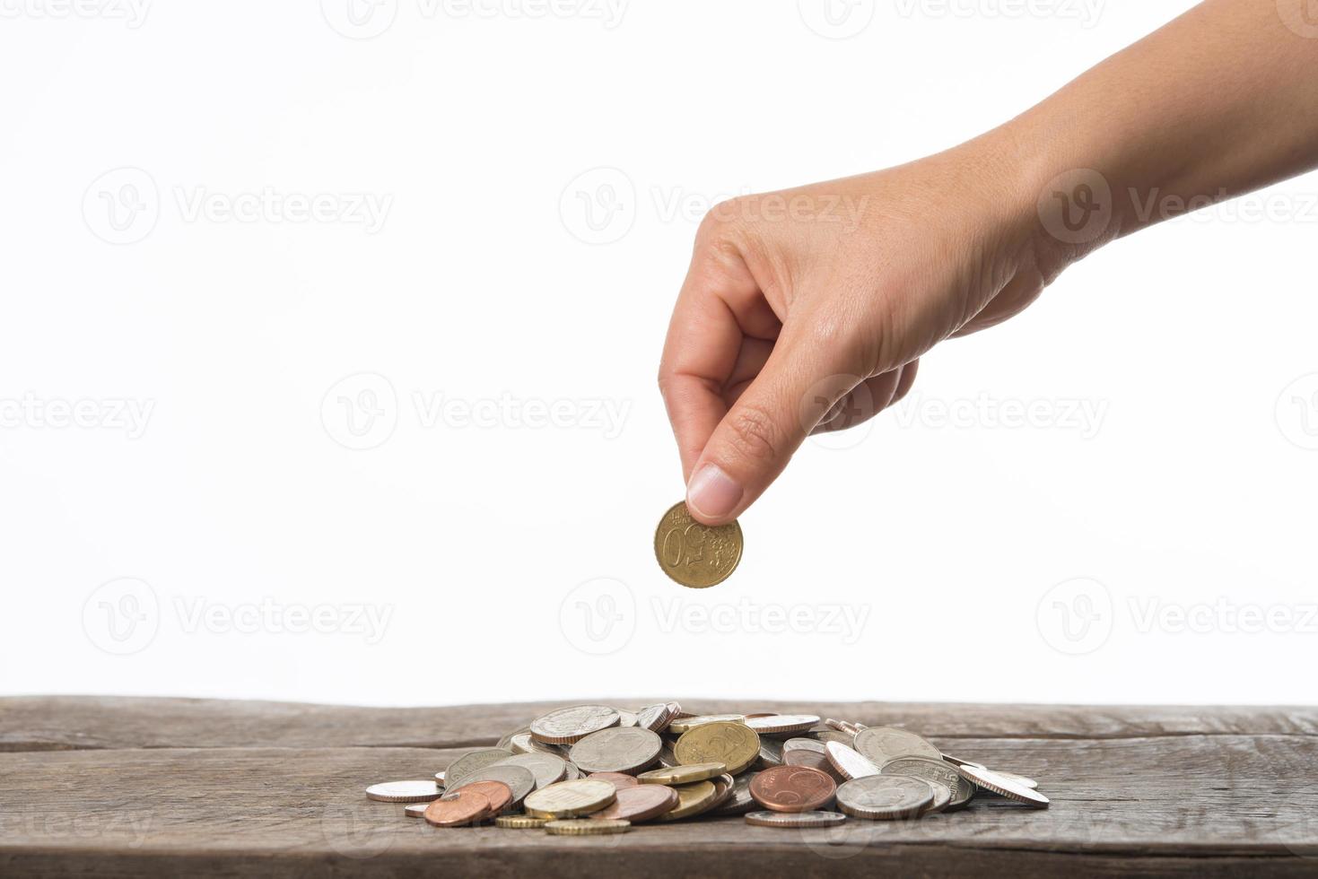 Woman's hand holding coins for collecting photo