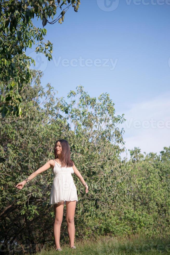 Beautiful woman outside at nature park photo