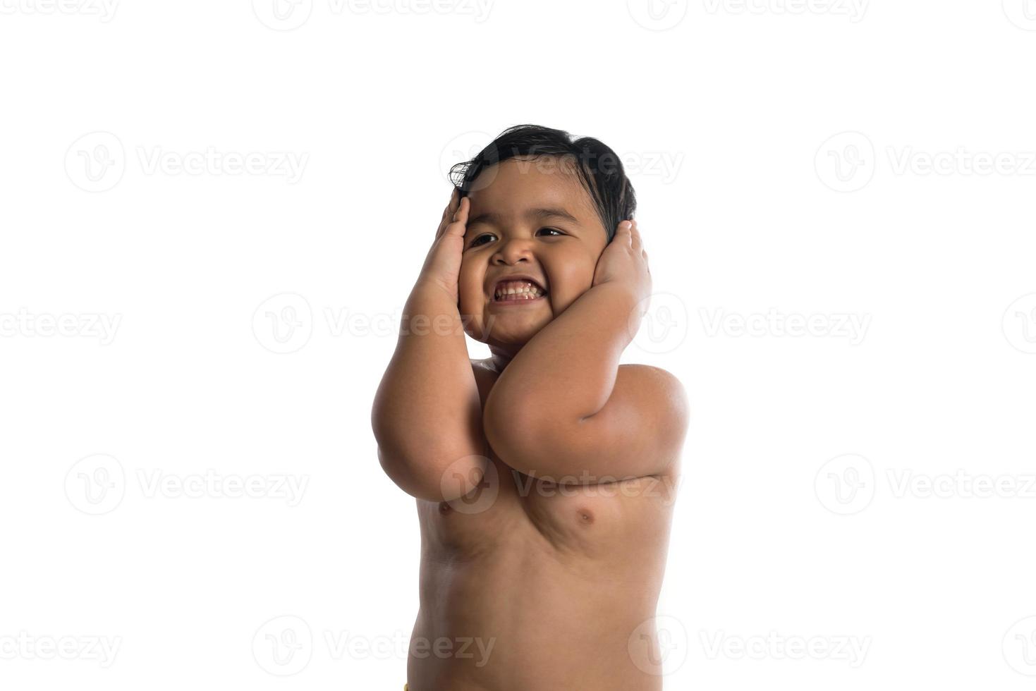 Happy little cute Asian boy cute smiling to camera isolated on white background photo