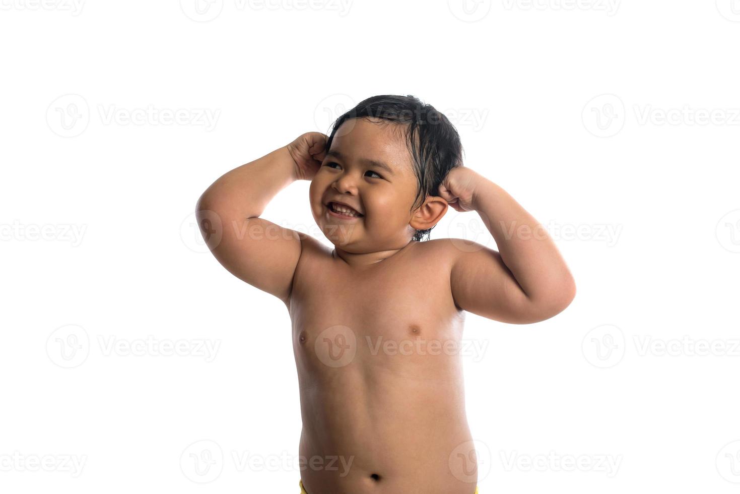 Happy little cute Asian boy cute smiling to camera isolated on white background photo