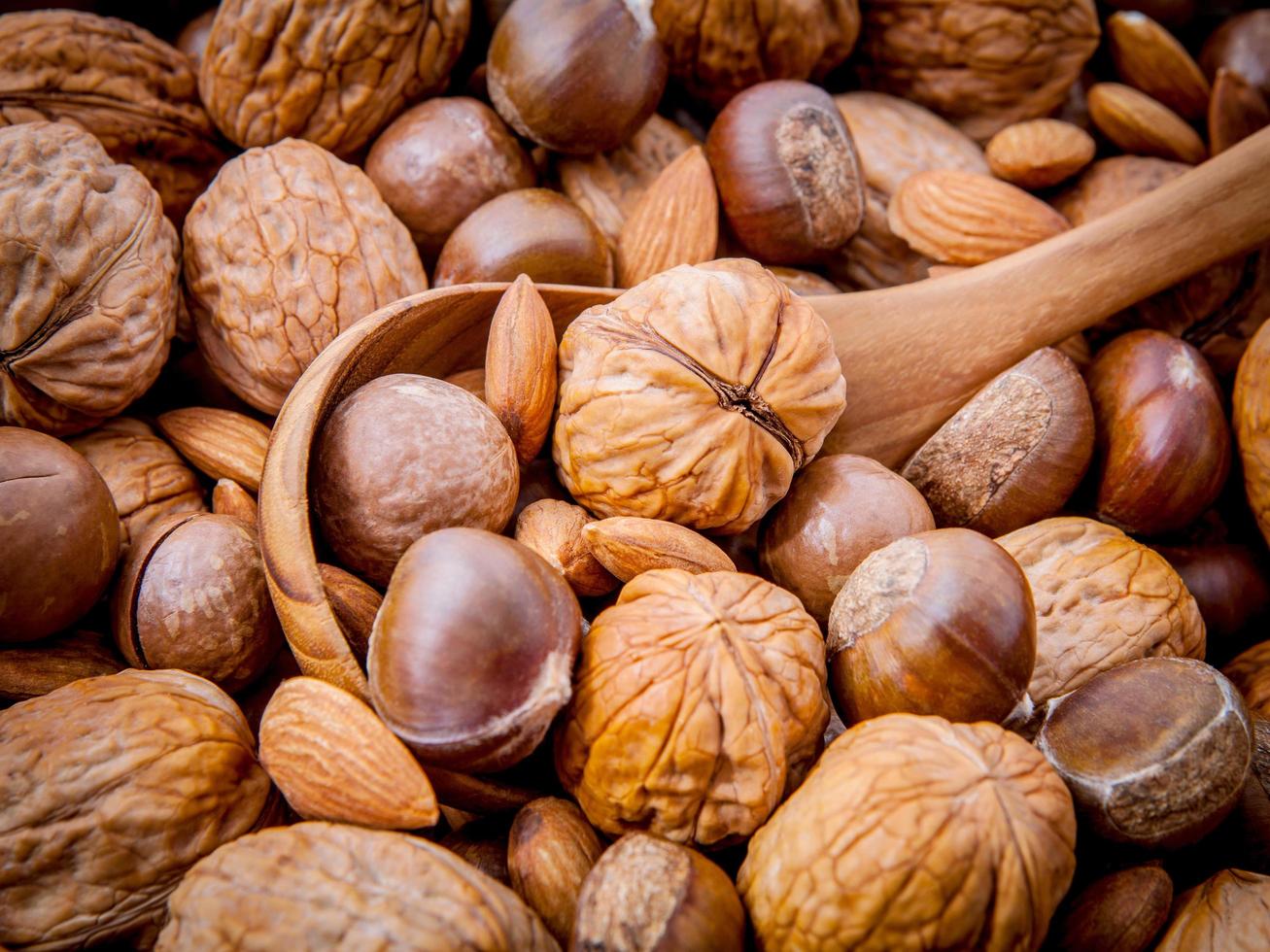 Assorted nuts with spoon photo