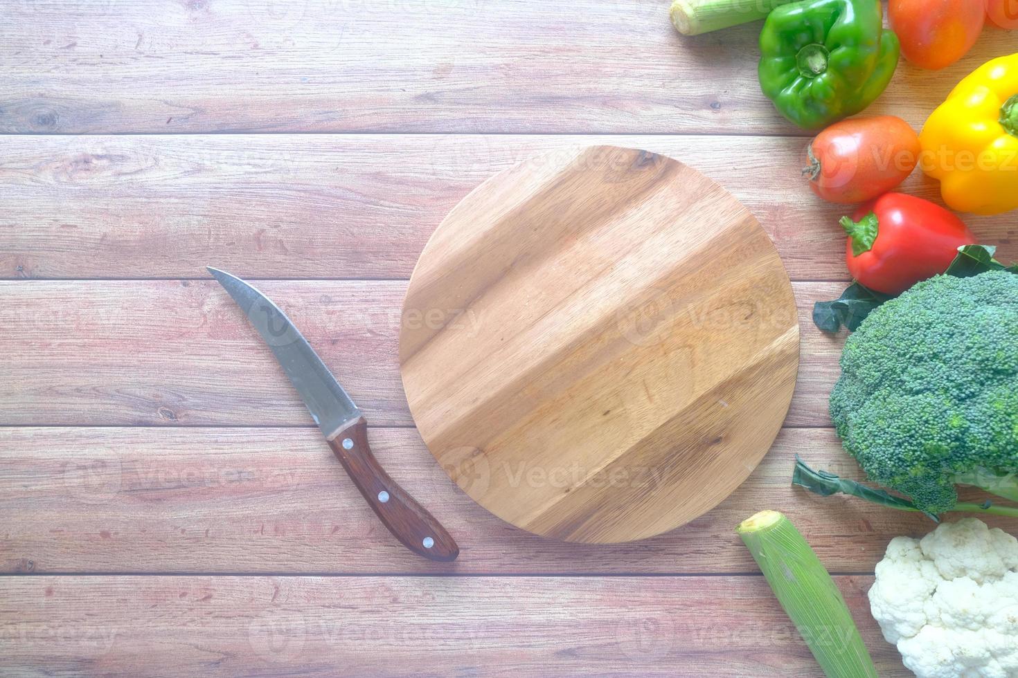 Healthy food selection with fresh vegetables on chopping board photo