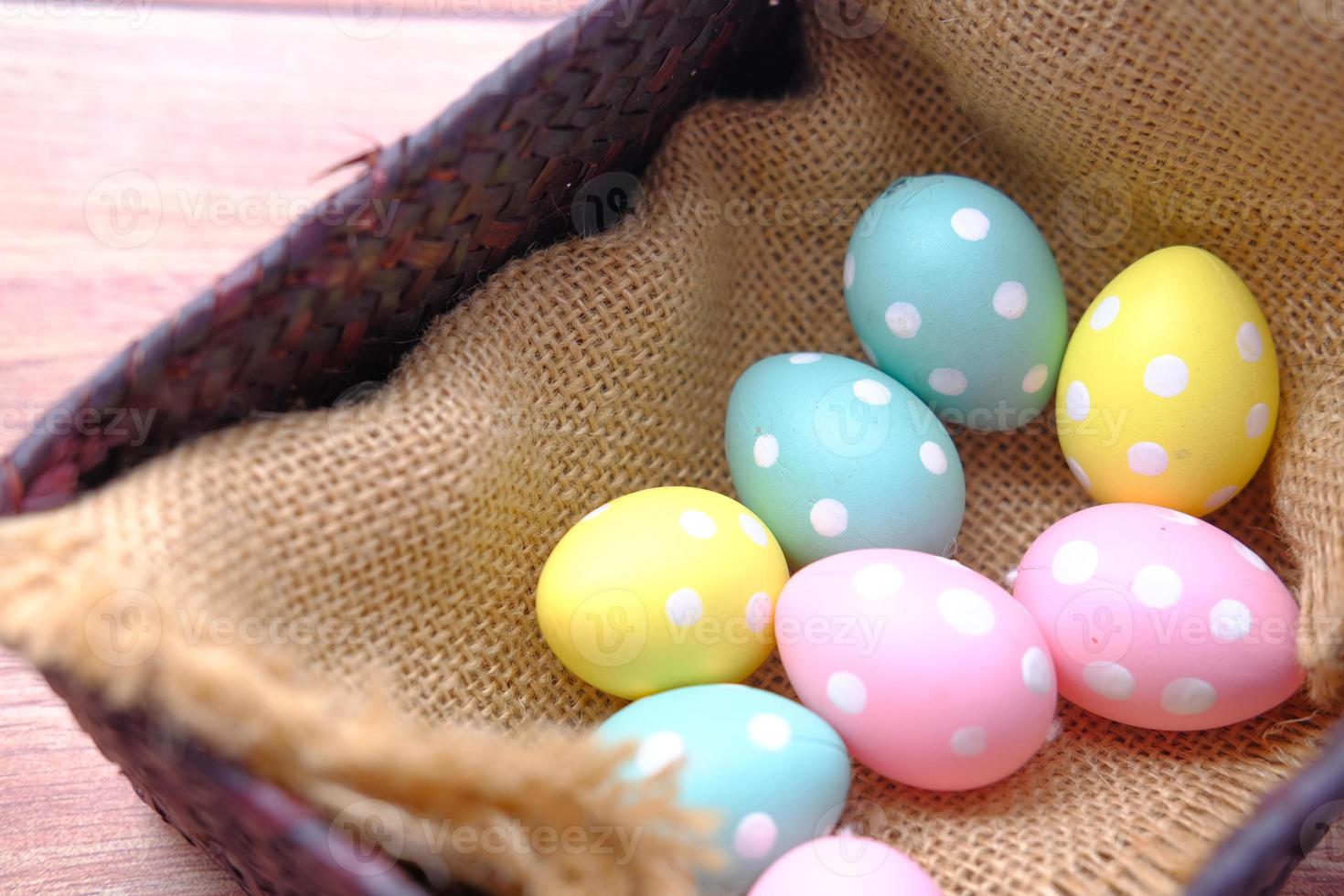 Easter concept with eggs on pink background photo