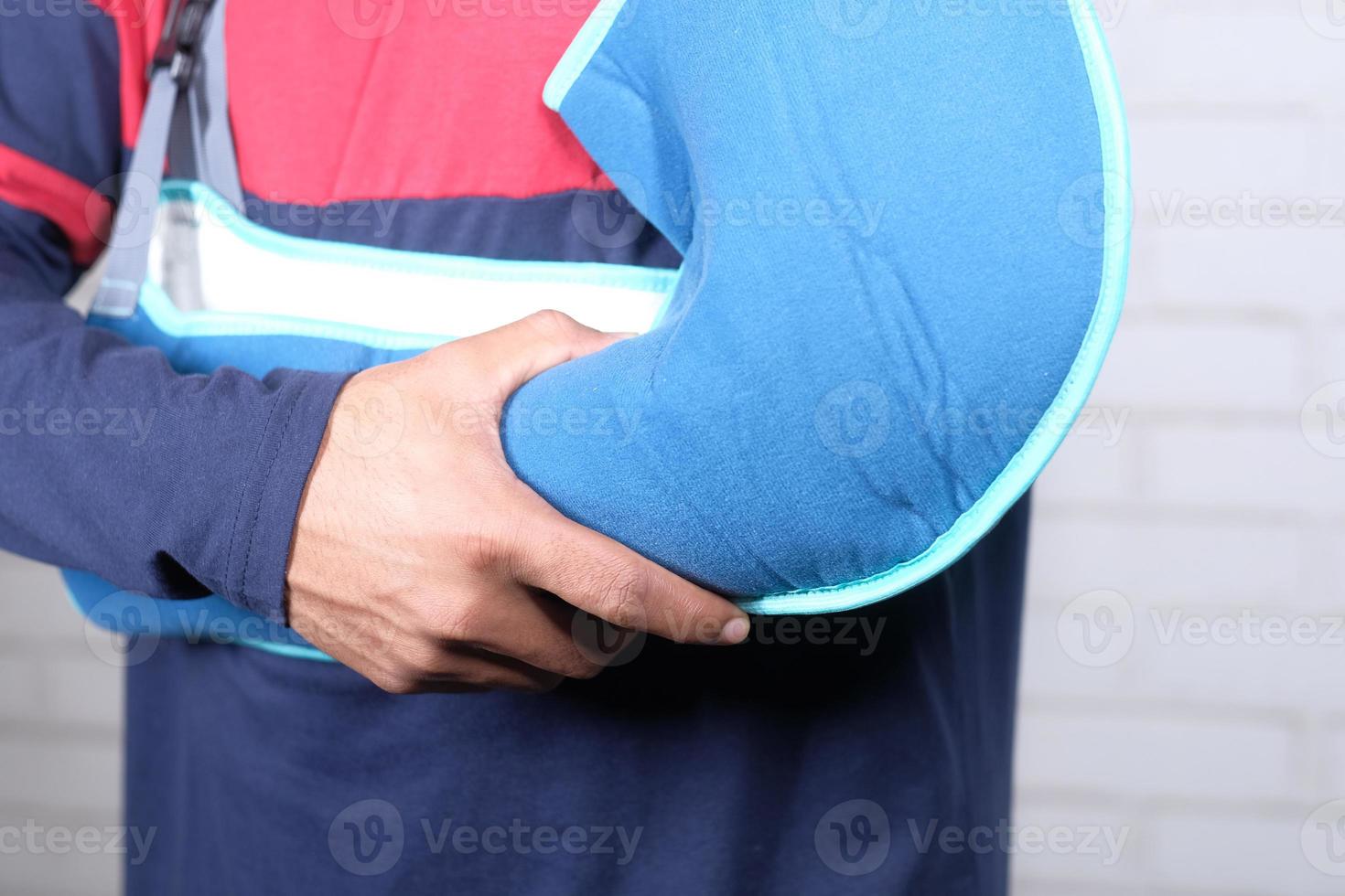 Young man wearing an arm brace for broken hand photo