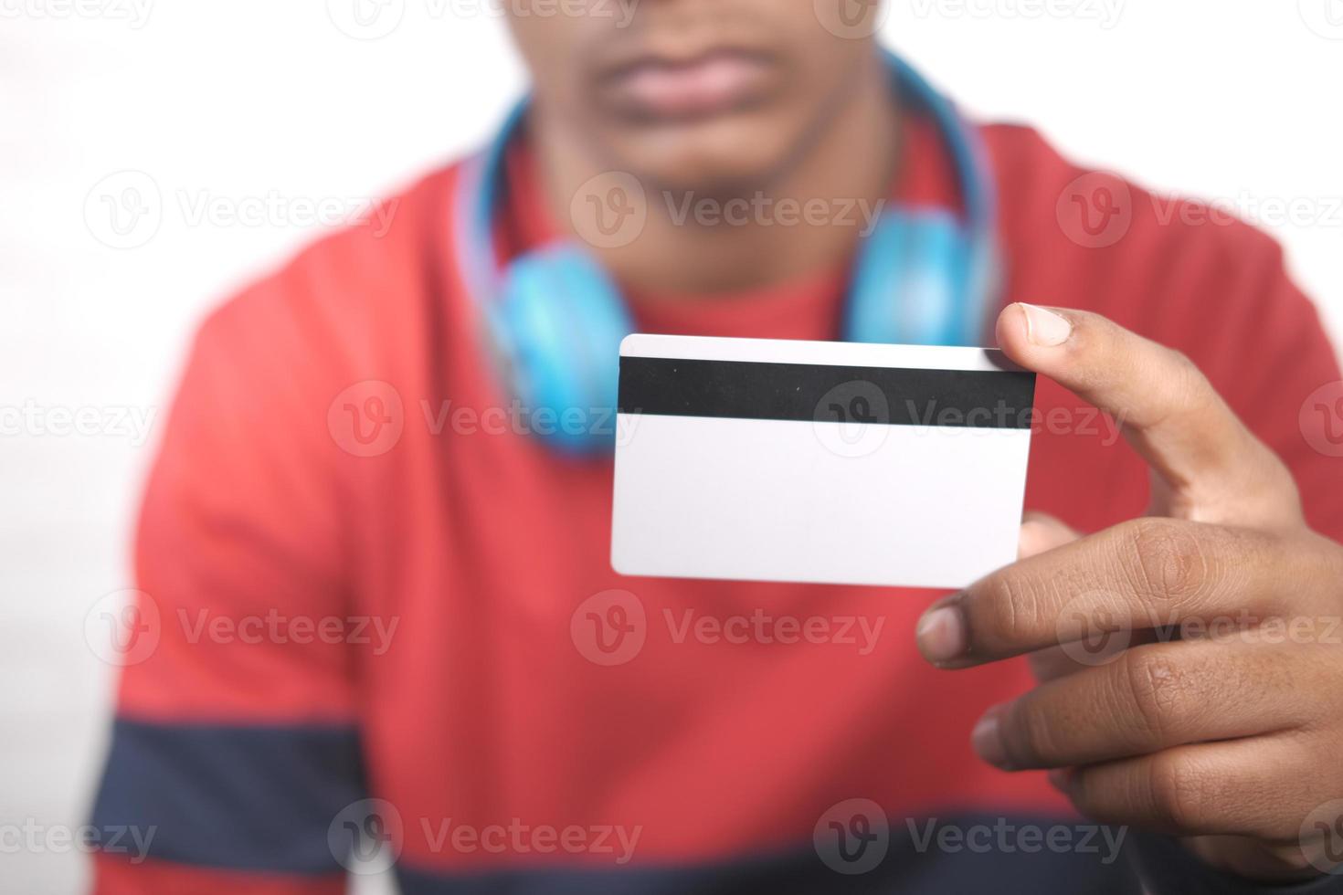 Hand holding credit card and reading information photo