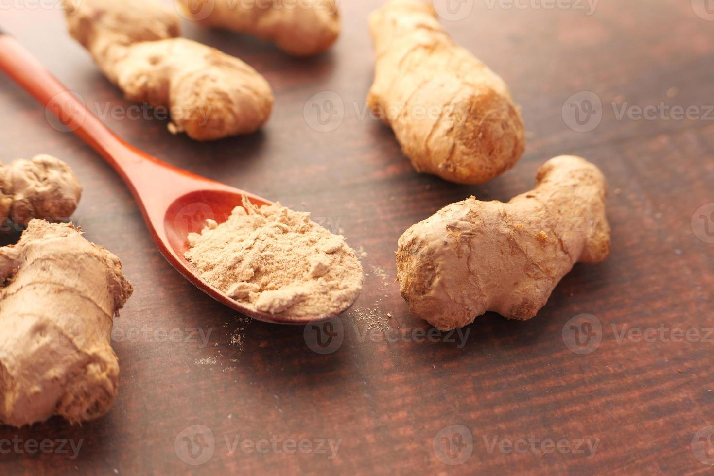 Close-up of ginger on chopping board photo