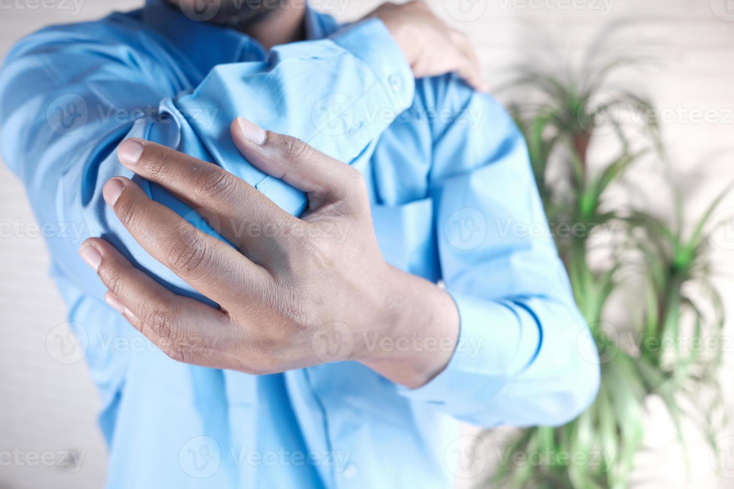 Man with elbow pain, pain relief concept photo