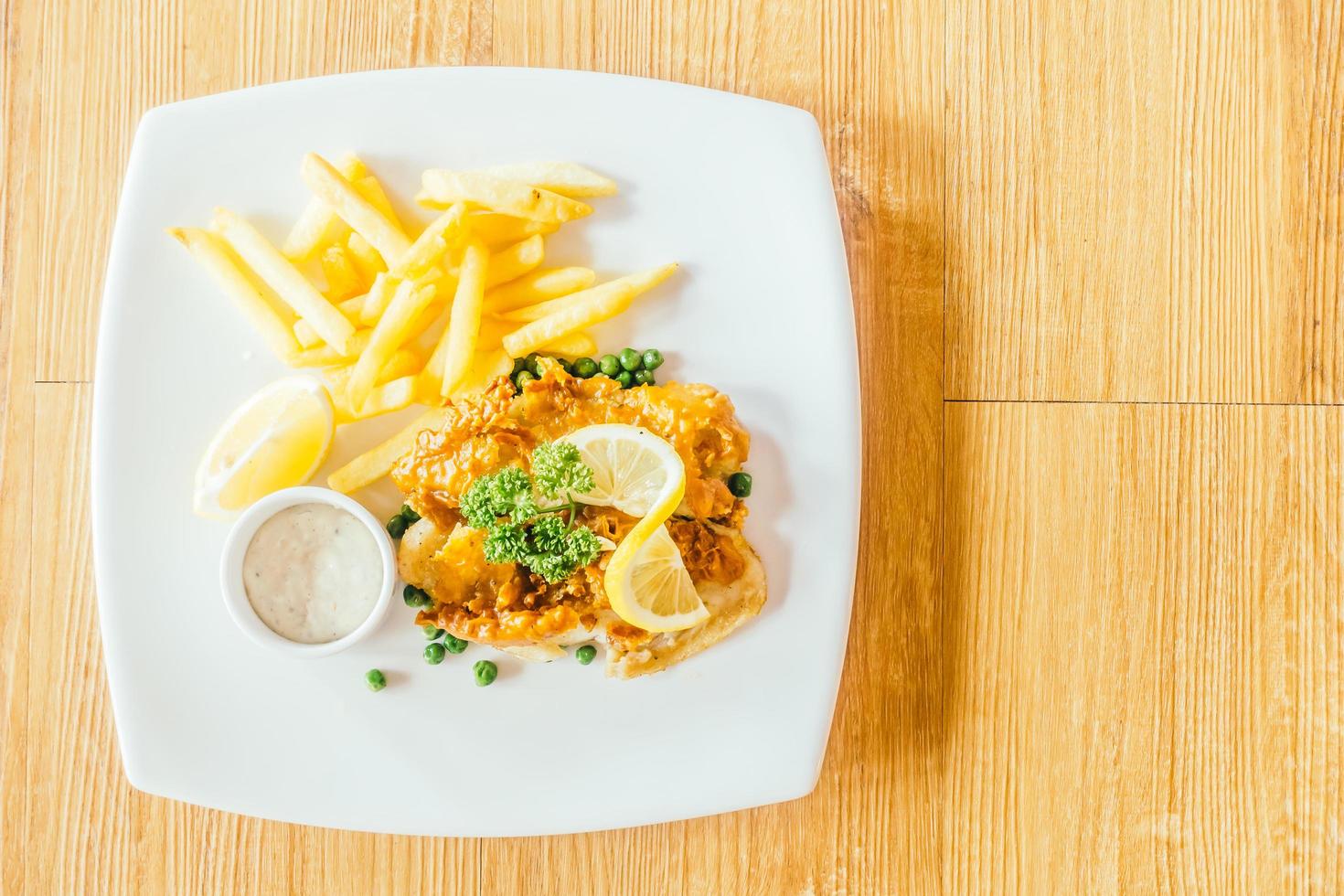 Fish and chips on the plate photo