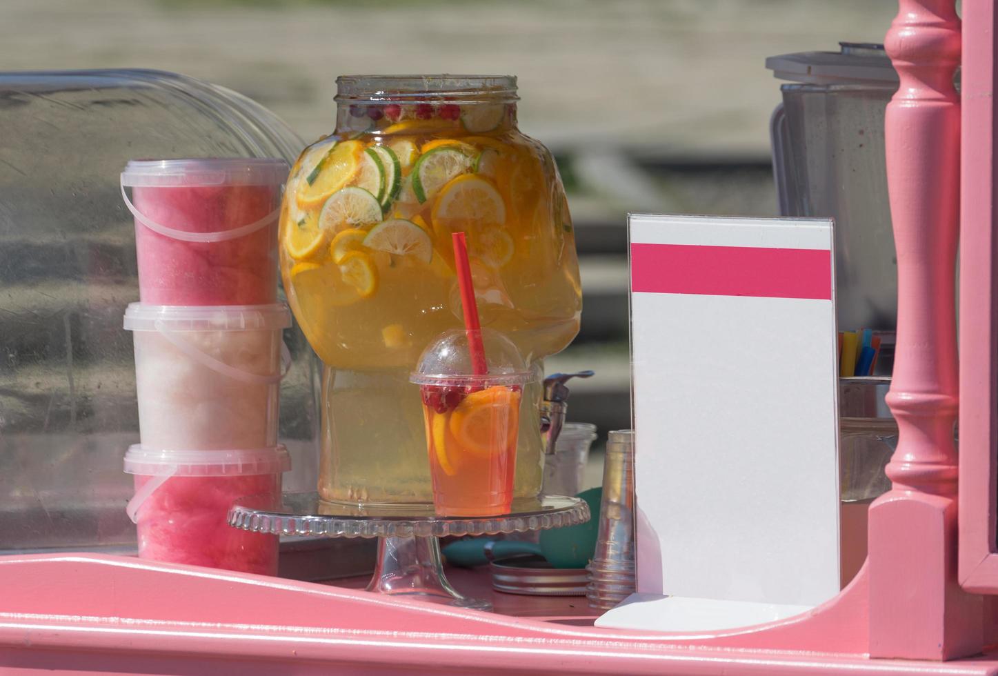 Outdoor restaurant counter with drinks and cotton candy photo