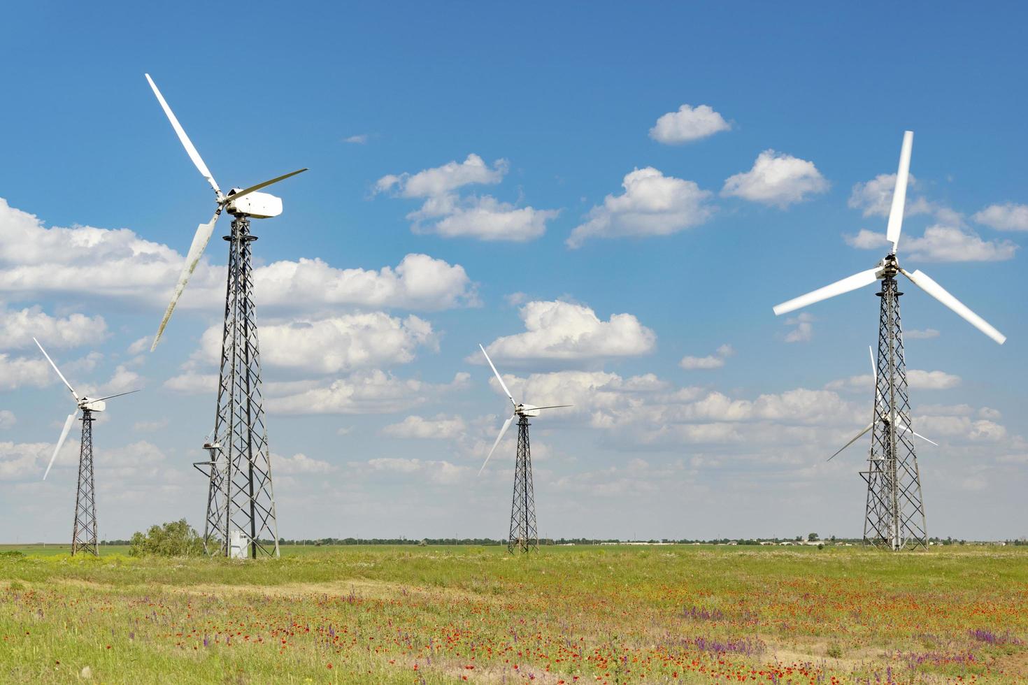 Wind turbines with cloudy blue sky in Yevpatoria, Crimea photo