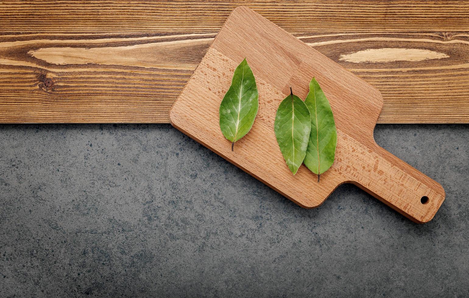 Bay leaves on a cutting board photo