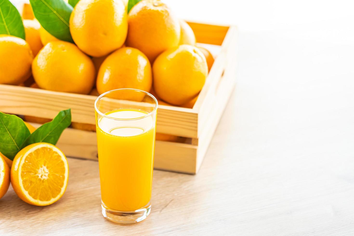 Fresh orange juice and oranges photo