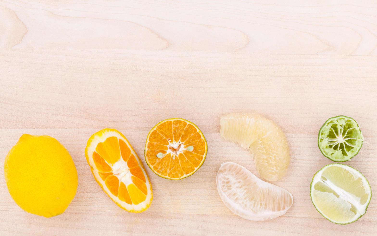 Citrus fruits on wood photo