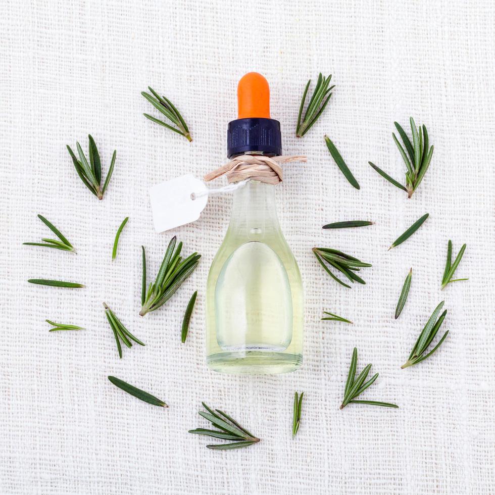 Rosemary oil on white photo