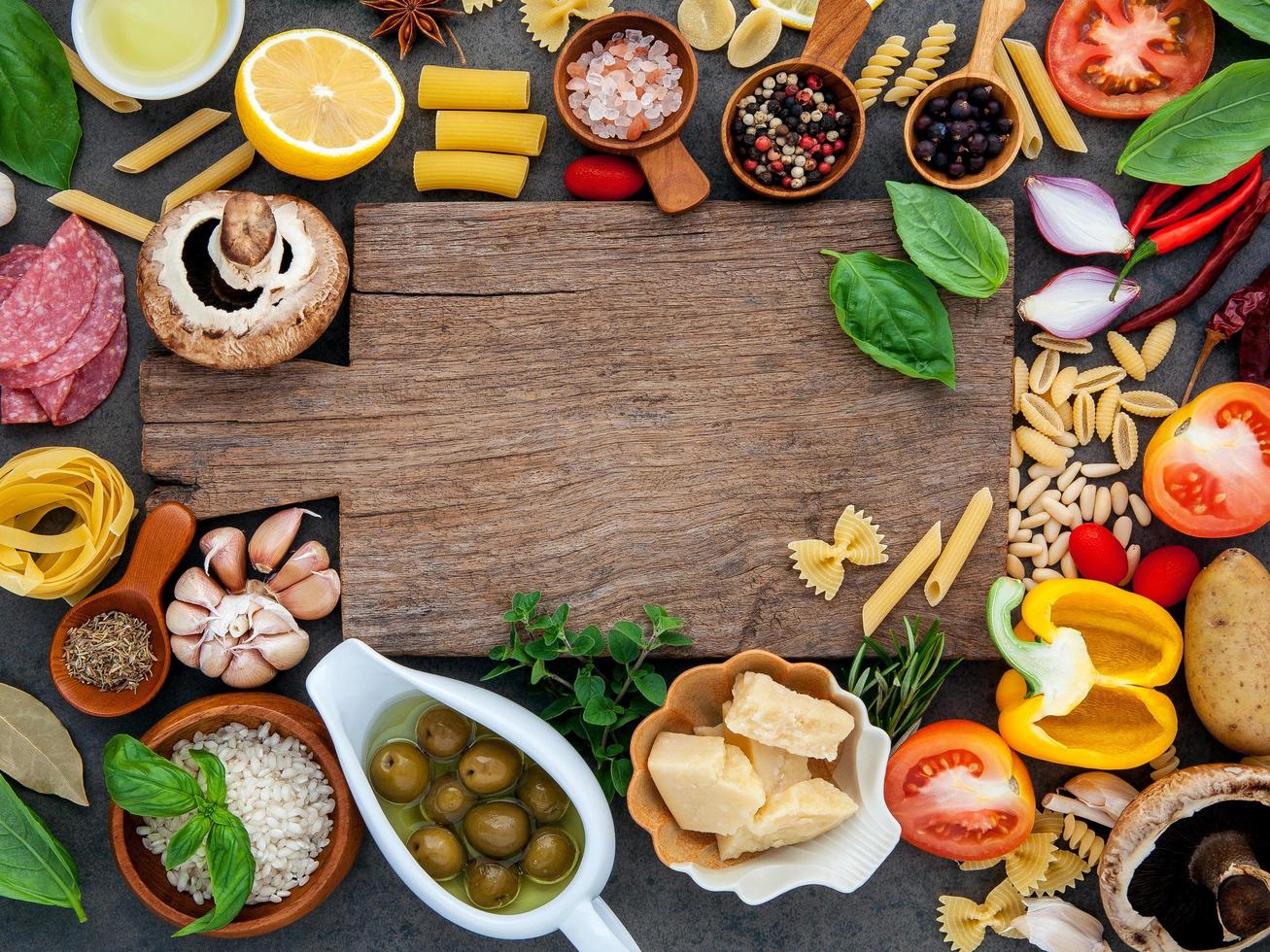 Wood board surrounded by fresh ingredients photo