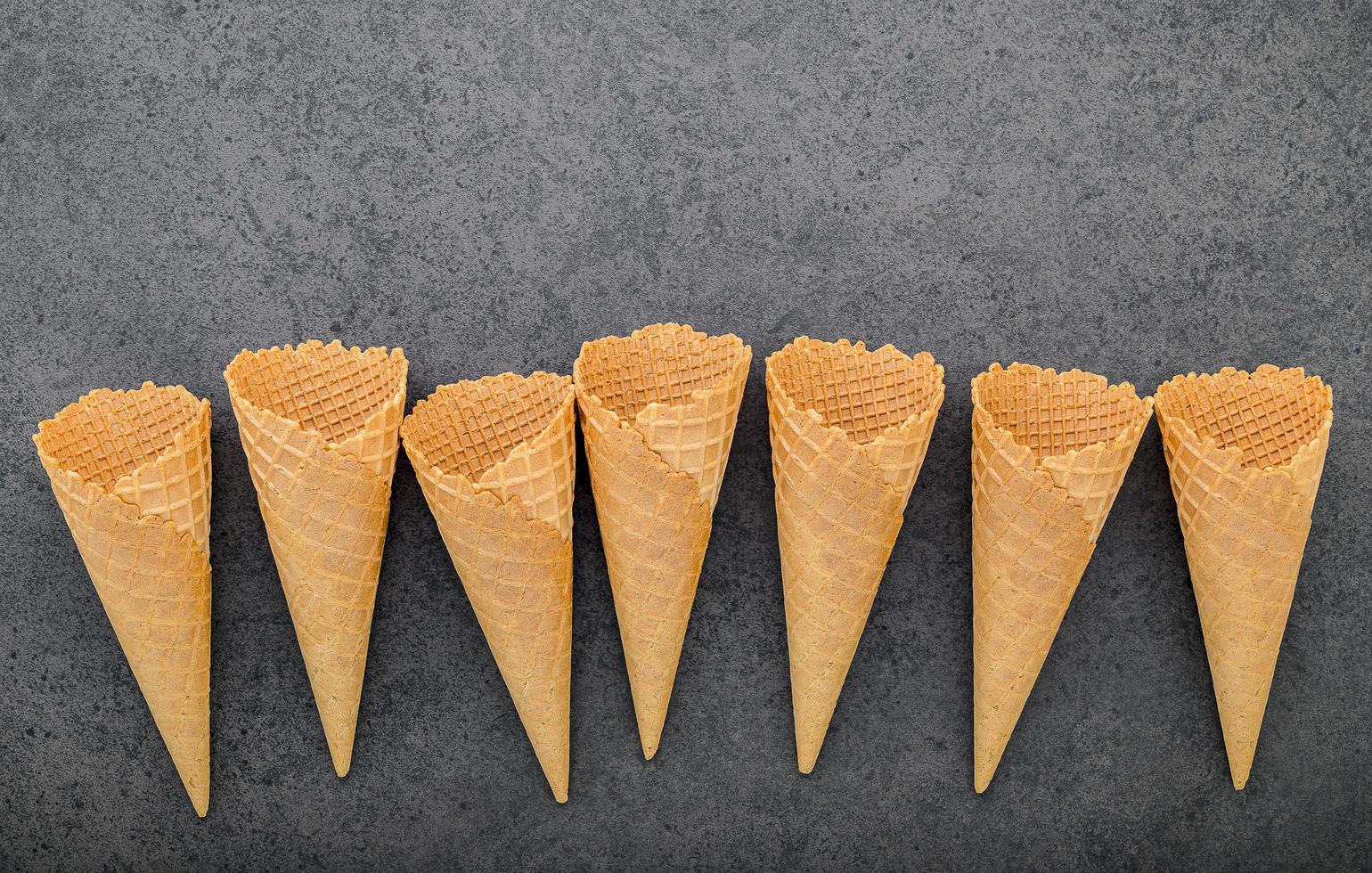 Ice cream cones on a dark gray background photo