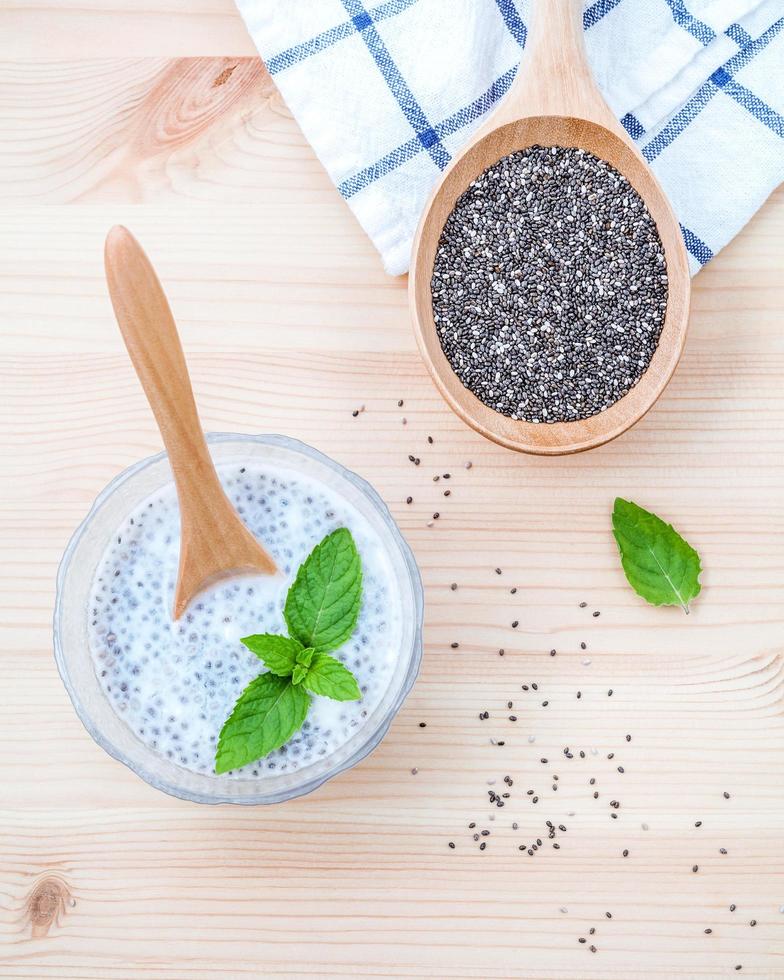 Chia seeds in a bowl on wood photo
