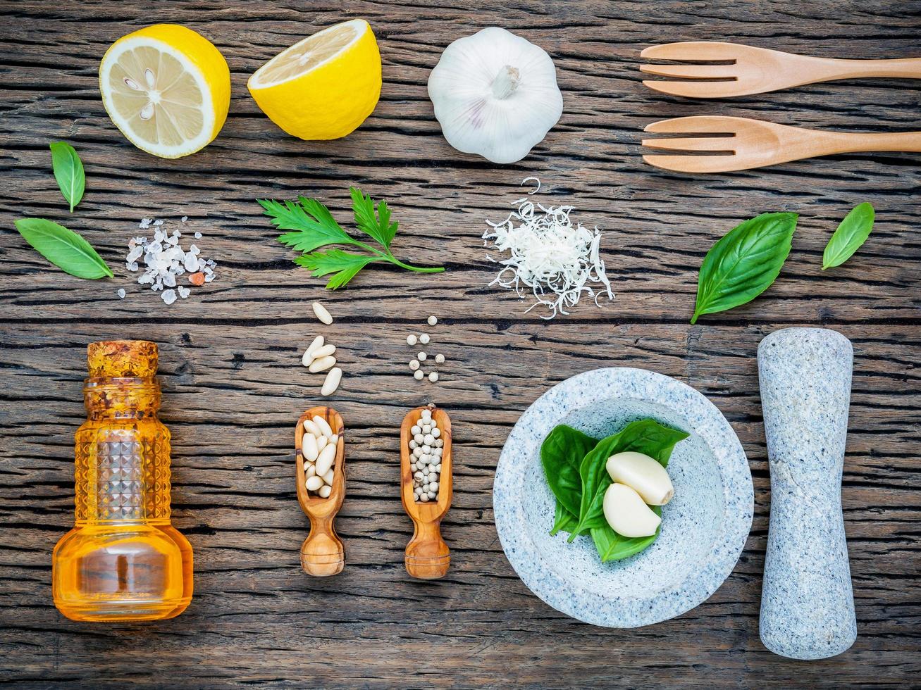 Ingredients for pesto on shabby wooden background photo