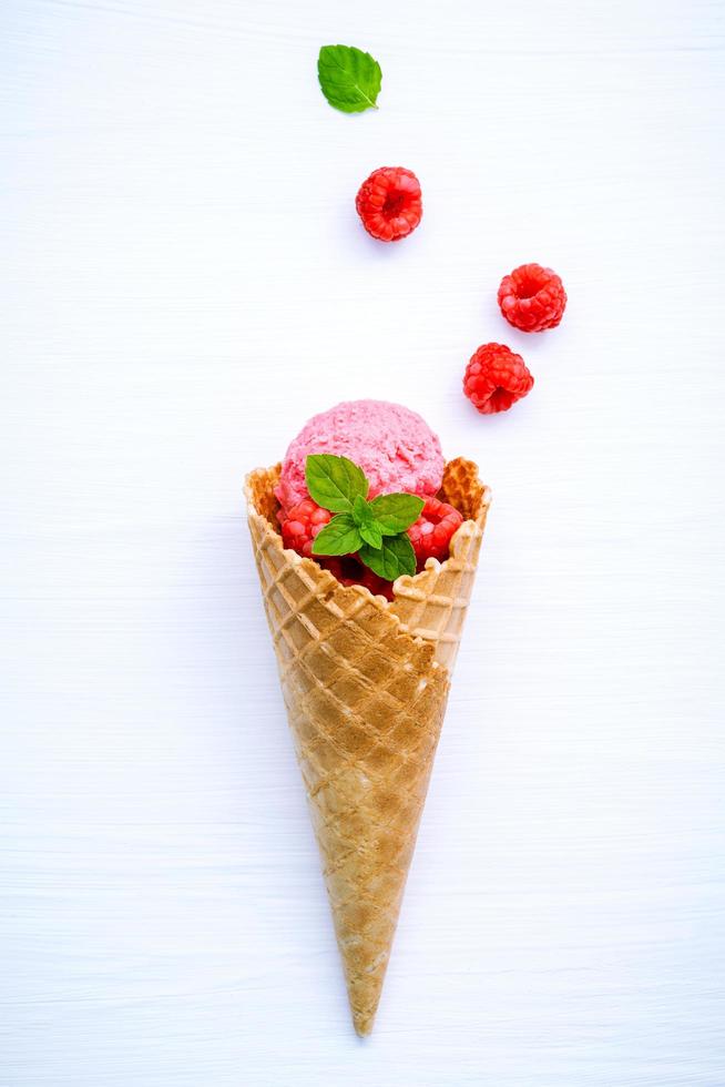 Raspberry ice cream in a cone photo