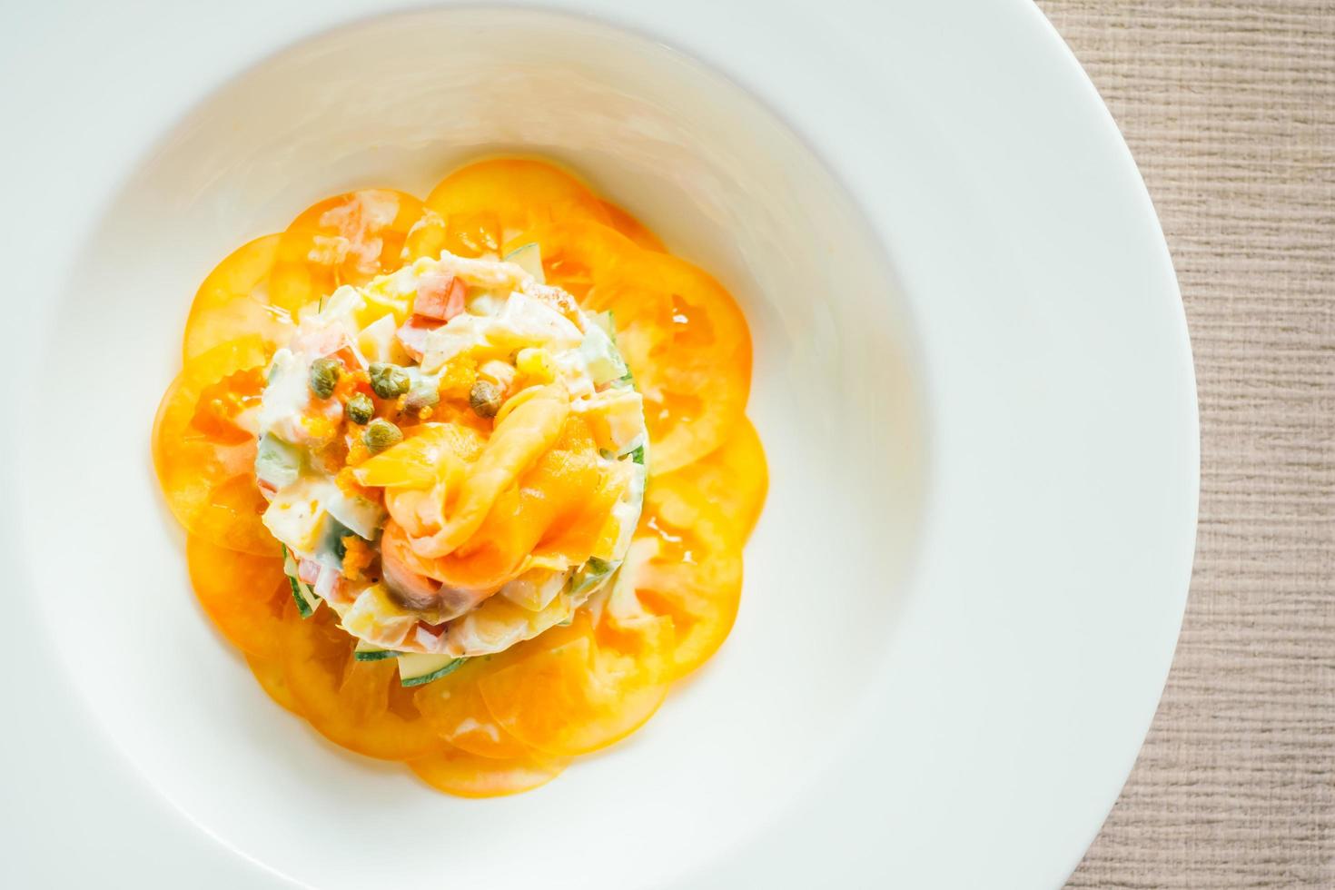 Smoked salmon salad on white plate photo