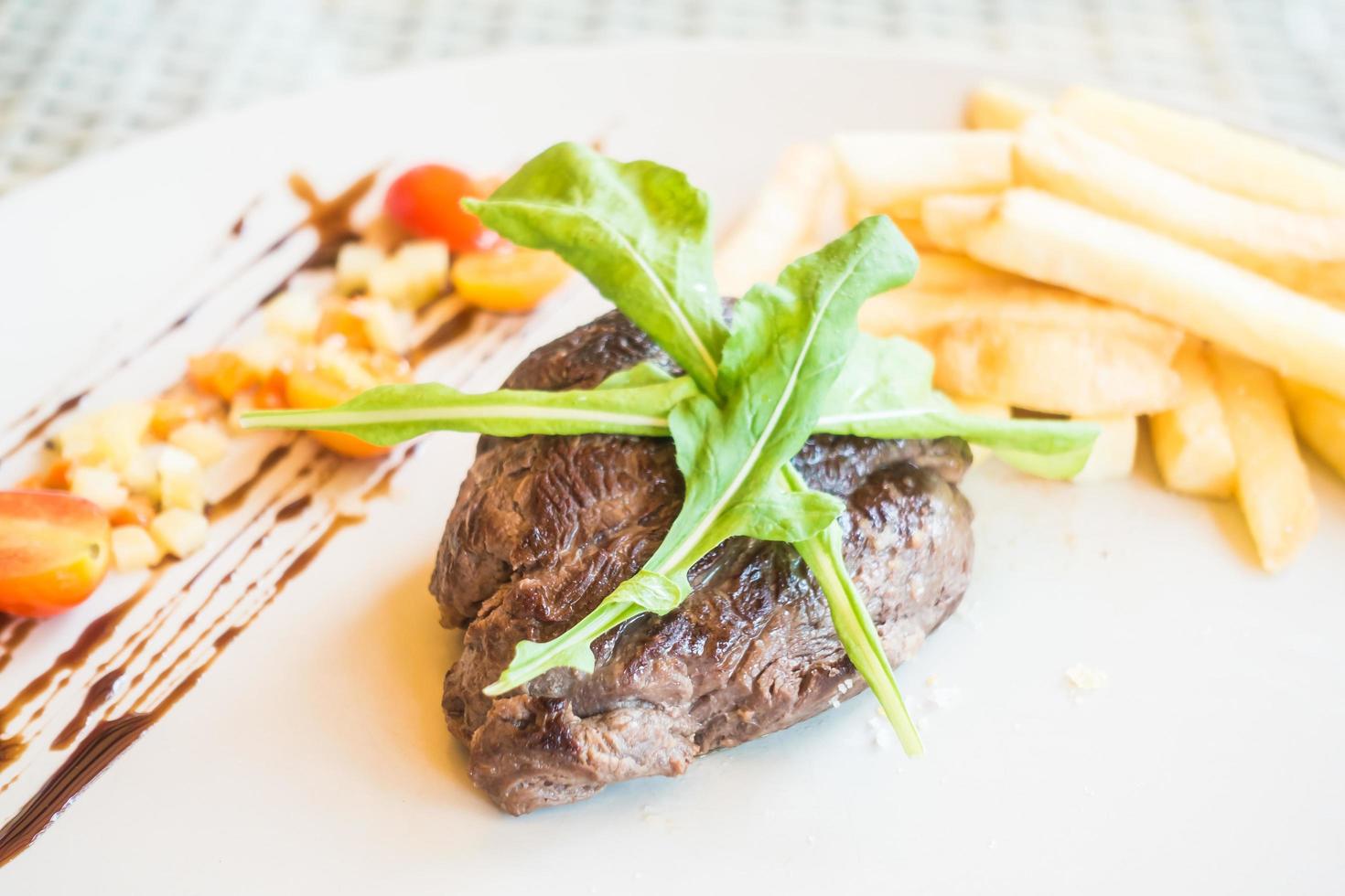 Beef steak on white plate photo