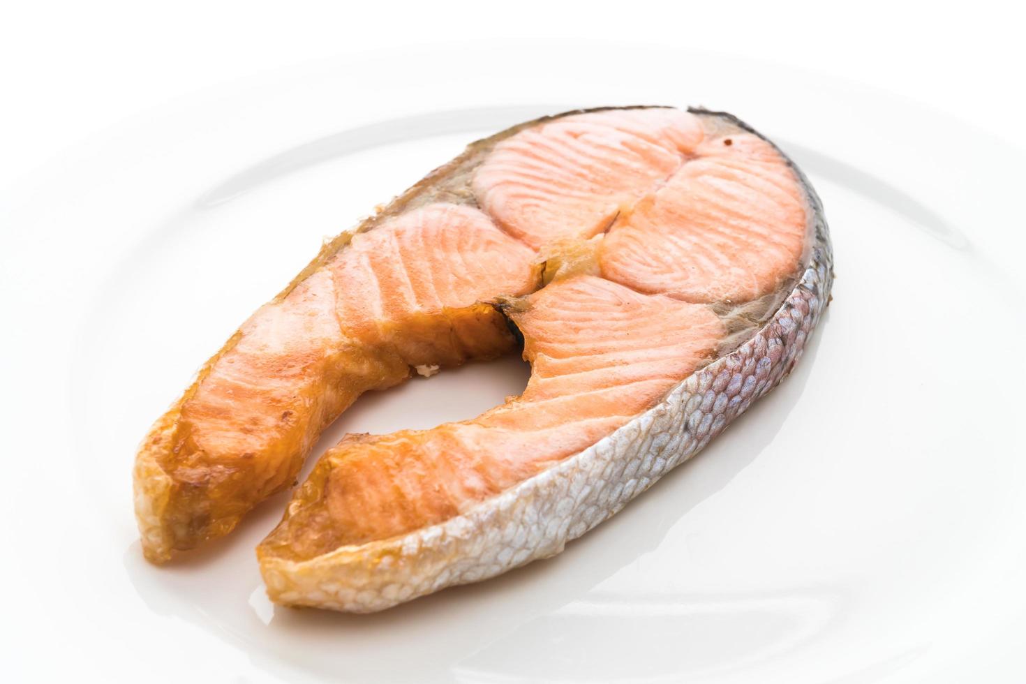 Fried steak salmon on white background photo