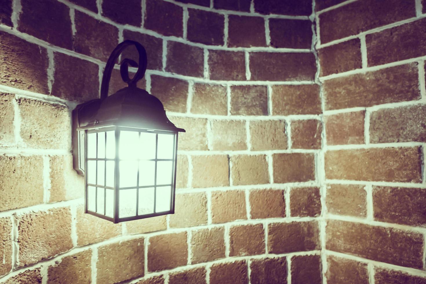 Lamp on a brick wall photo