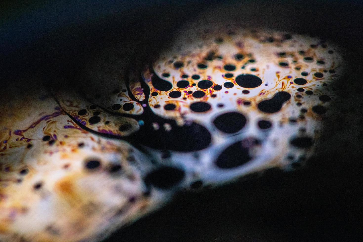 Close-up of colorful oily liquid photo