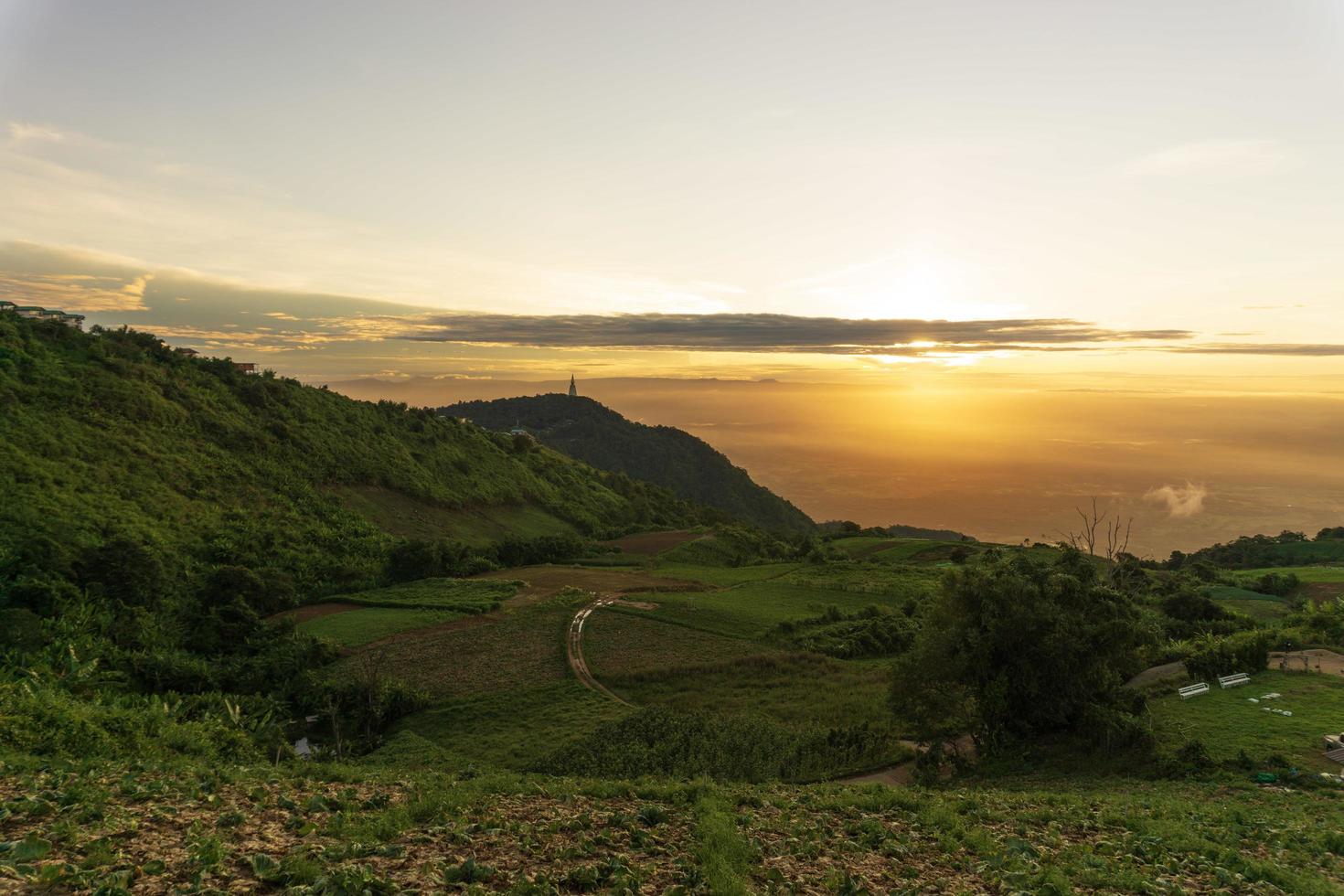 Landscape with colorful sunrise overlooking a valley photo