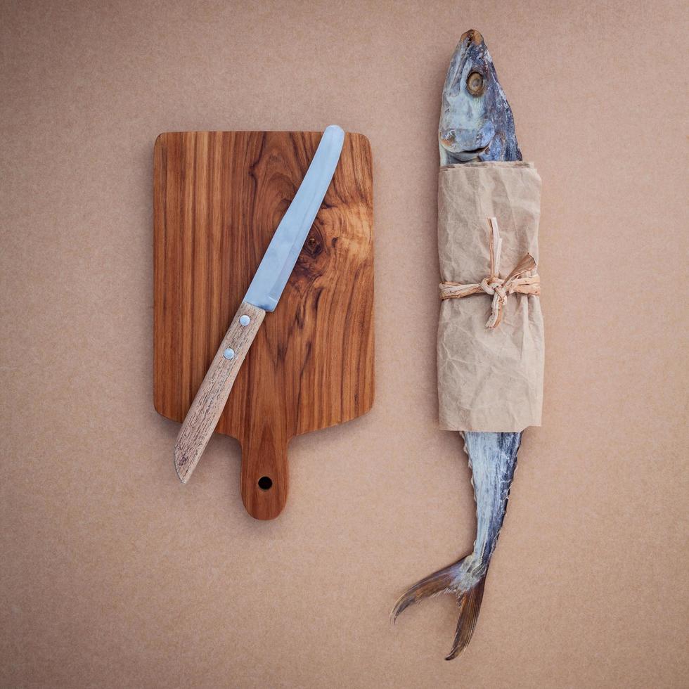 Fish and a cutting board photo