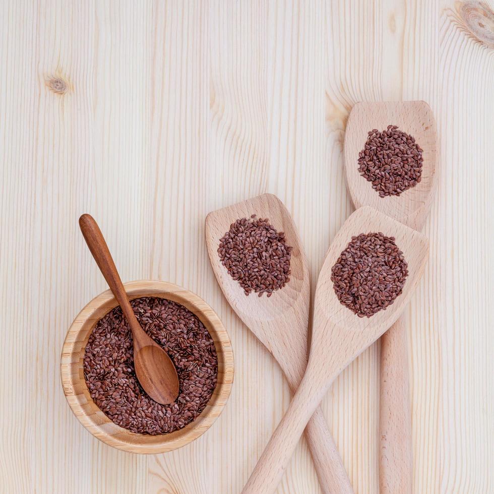 Flax seeds in a bowl and spoons photo