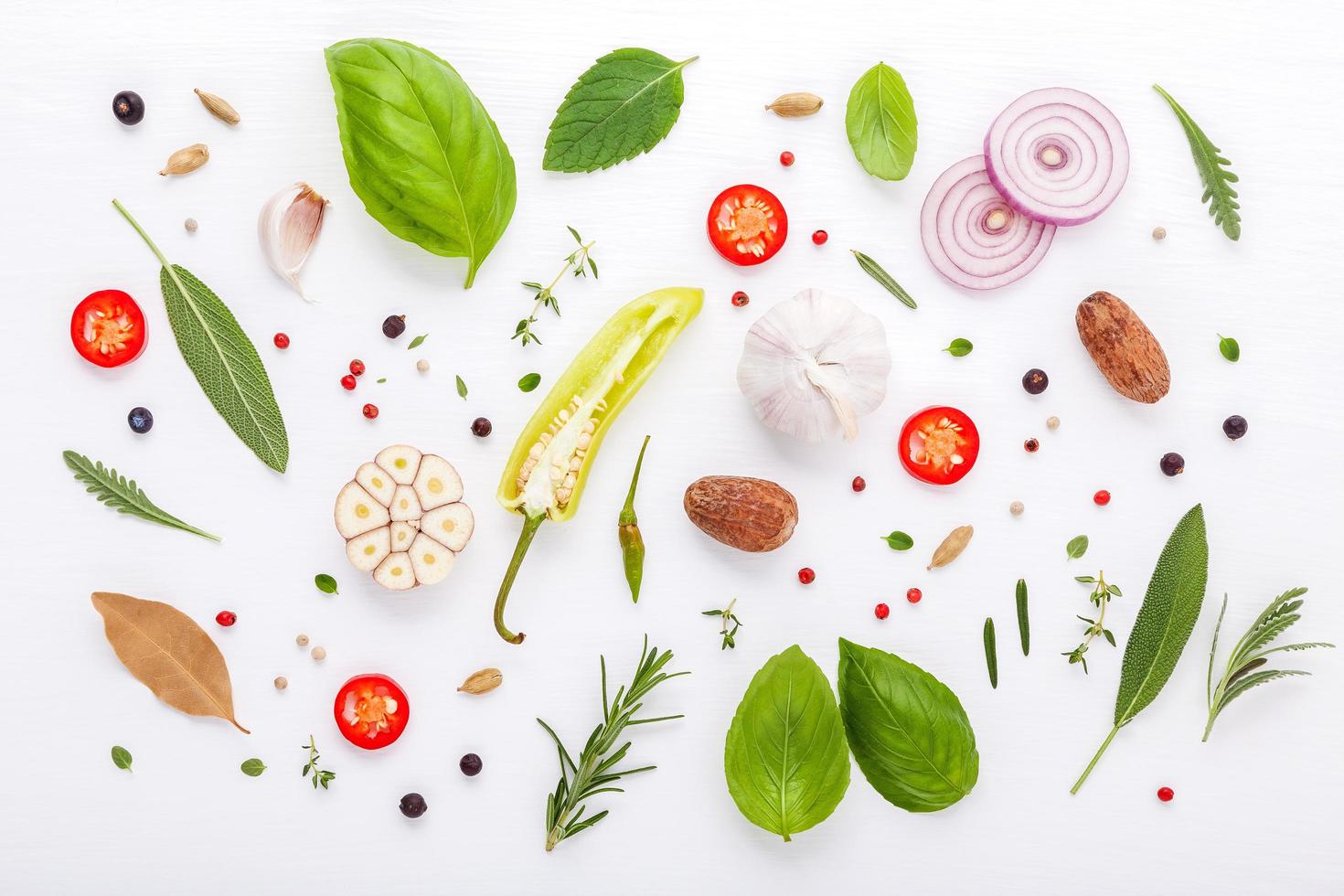 Fresh herbs and veggies on a white wooden background photo