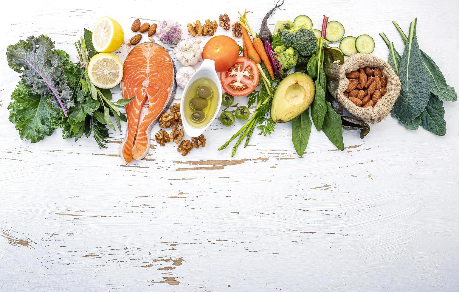 Fresh ingredients with salmon on a shabby white background photo