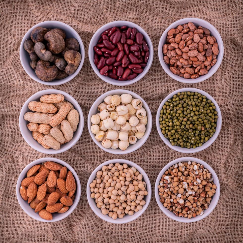 Beans, lentils, and nuts in bowls photo