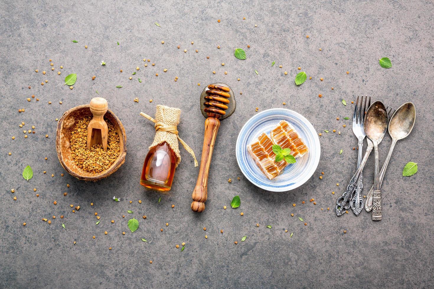 Raw honey on a gray background photo