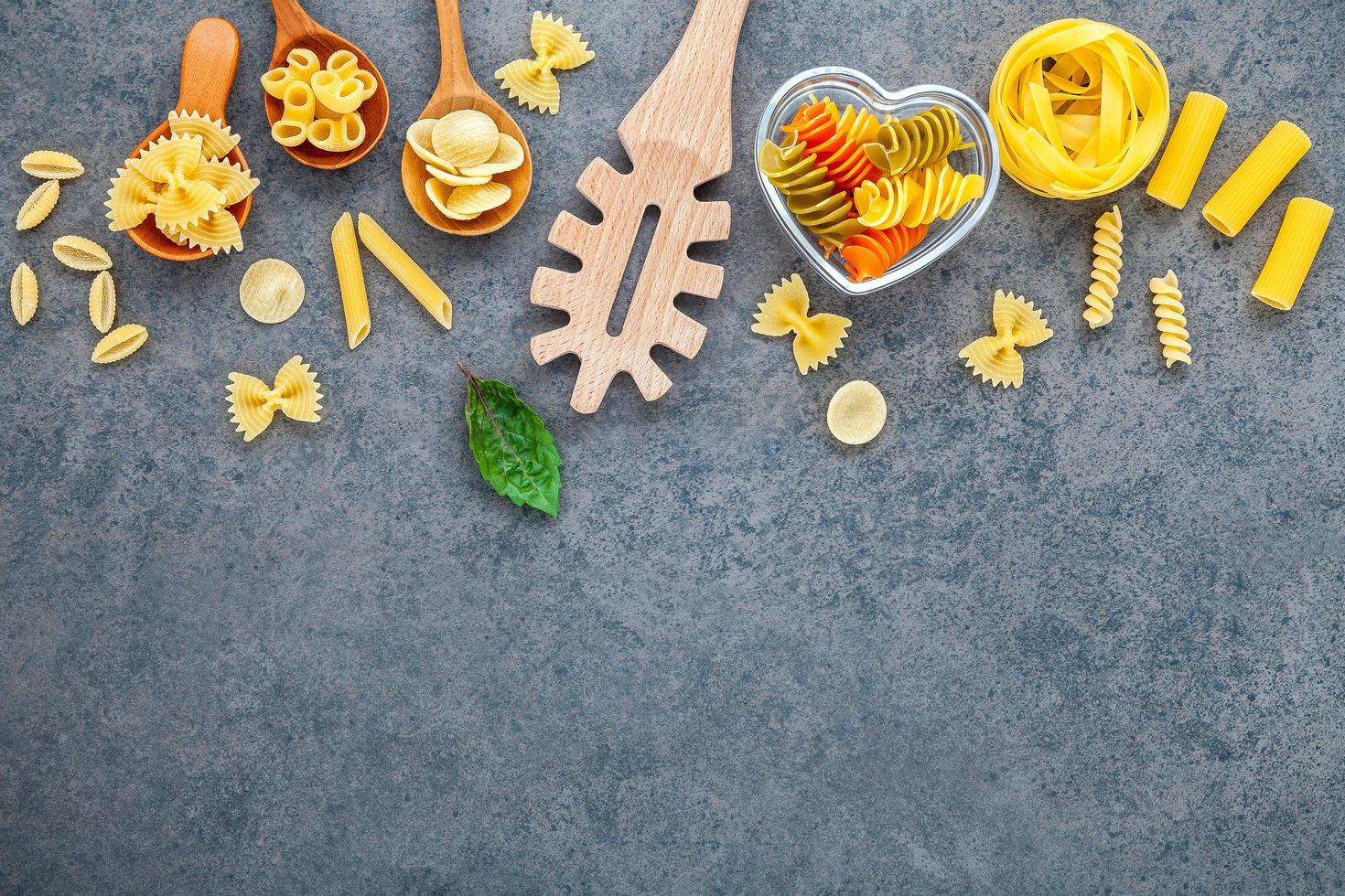 Wooden utensil and pasta photo