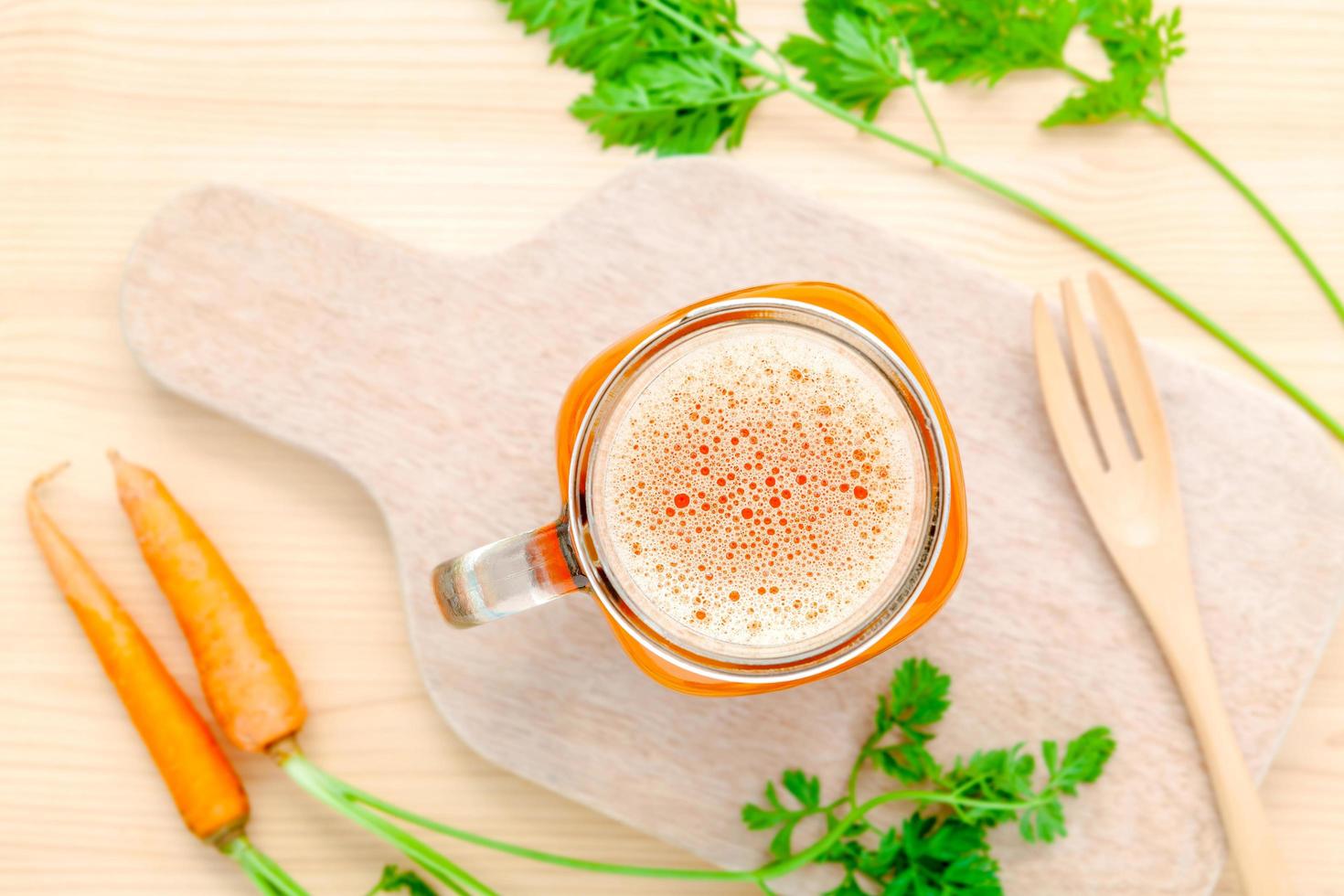 Top view of a glass of carrot juice photo