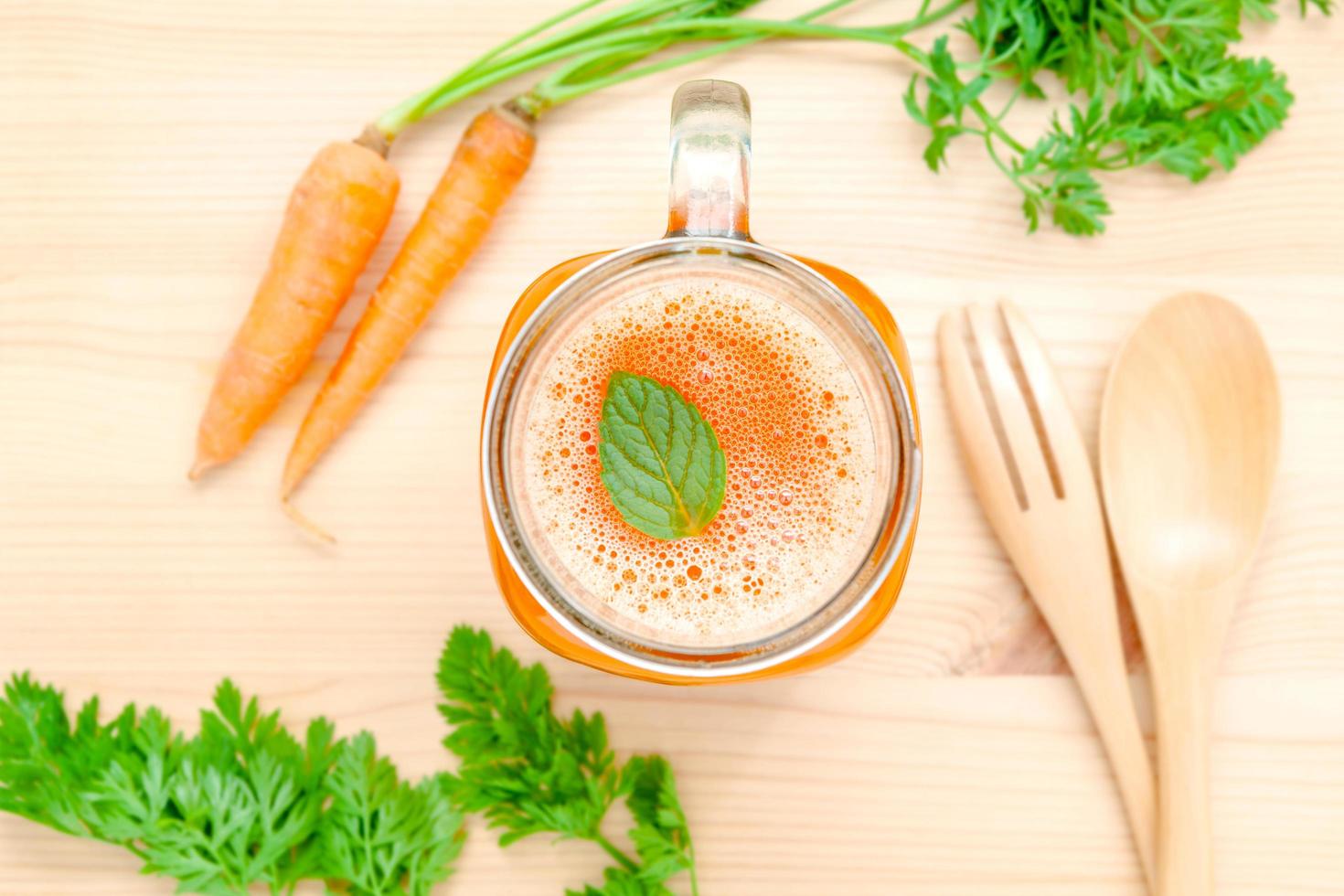 Glass of fresh carrot juice photo