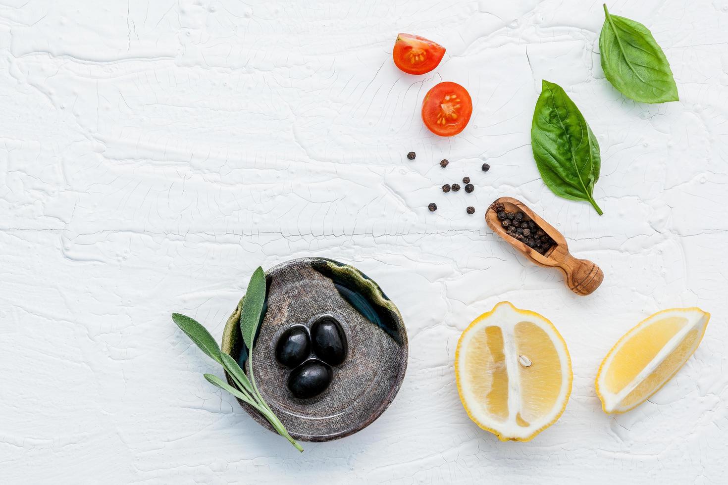 Top view of Italian ingredients on a shabby white background photo