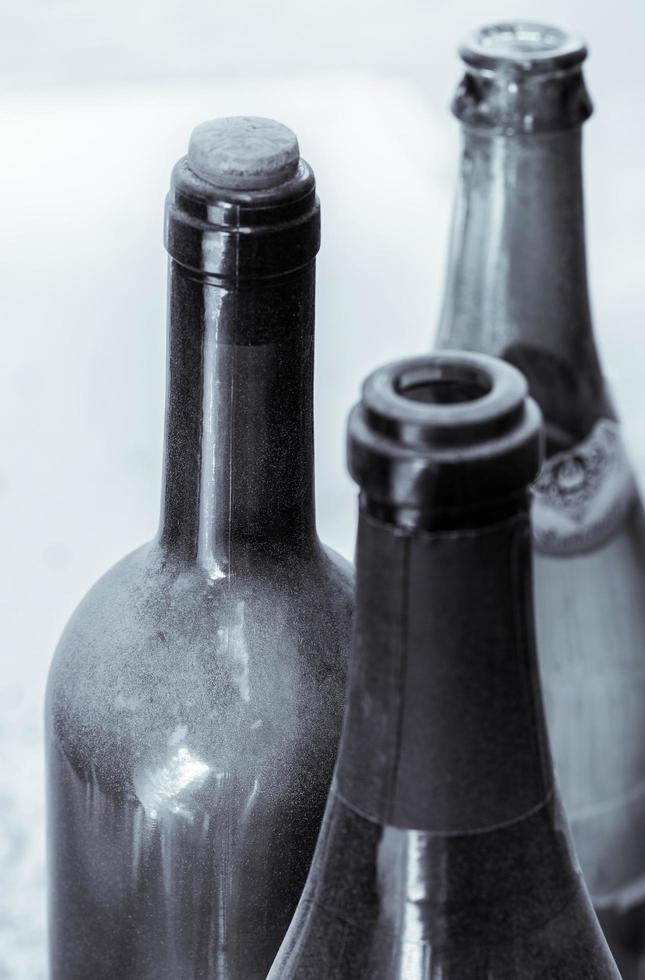 Black and white shot of wine bottles photo