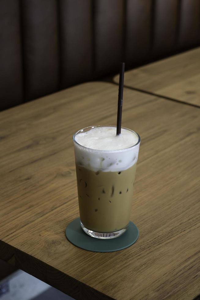 Iced coffee drink on wooden table photo